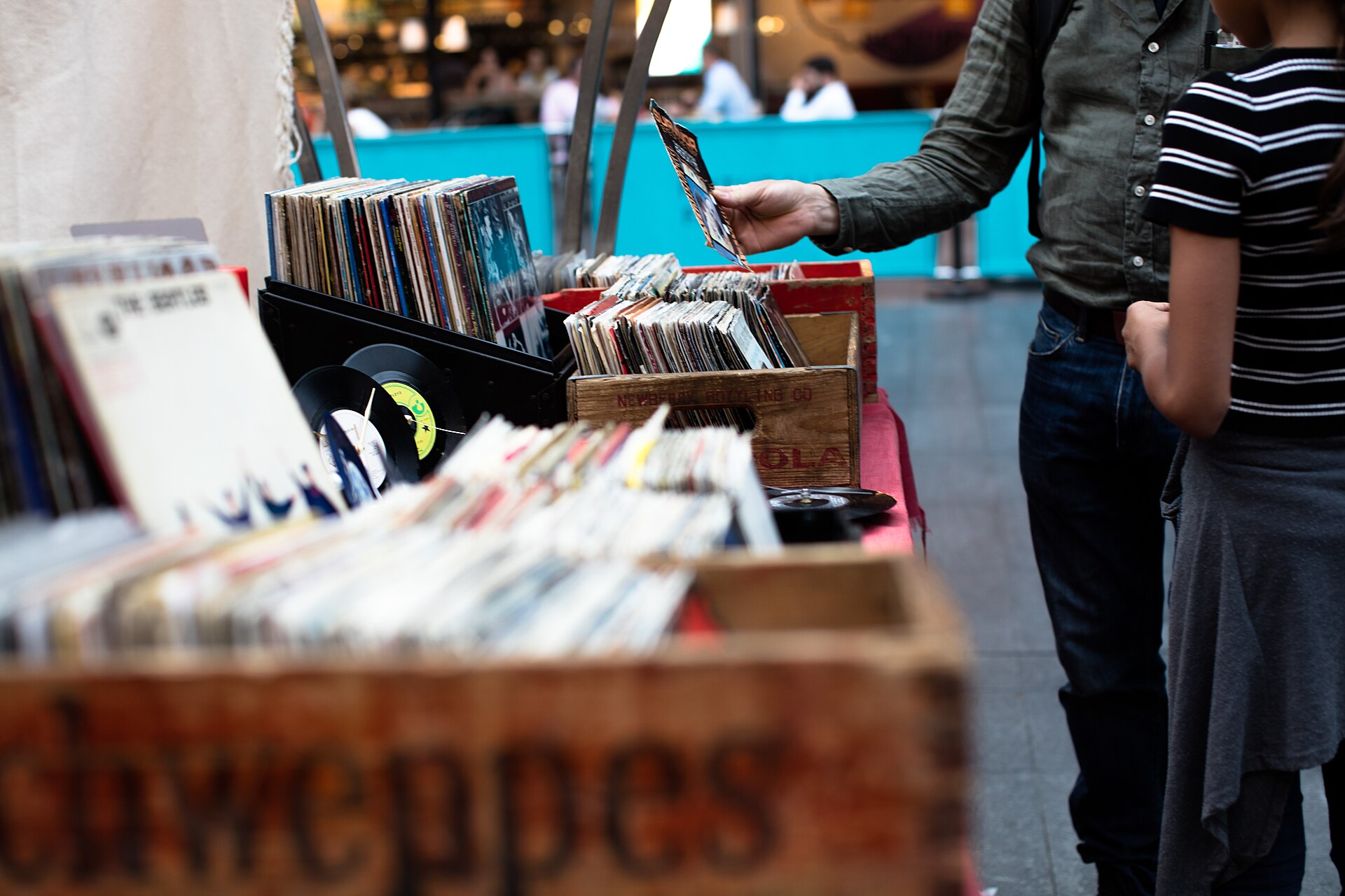 Digging through crates of vinyl at a record fair